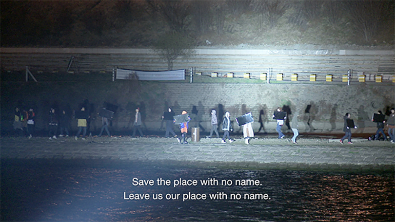 Minouk Lim, ‘S.O.S.-Adoptive Dissensus’, 2009, site-specific performance, video documentation, HD video and sound projection, three-channel version, each 11:00 min, still images from video. Image courtesy the artist and Haus der Kulturen der Welt.