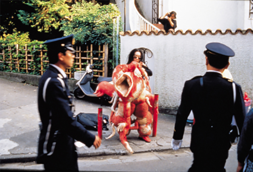 Lee Bul in her monster costume in Tokyo during her 12-day performance, ″Sorry for suffering - You think I'm a puppy on a picnic?″, 1990. Image provided by SeMA.